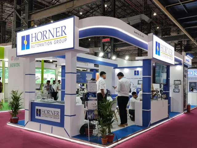 Horner Automation Group corner exhibition booth with illuminated fascia and demo counters
