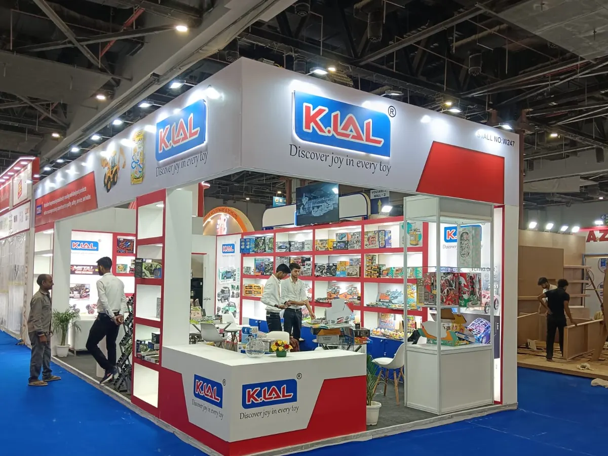 K.Lal toys exhibition stall in New Delhi with red and white display shelving
