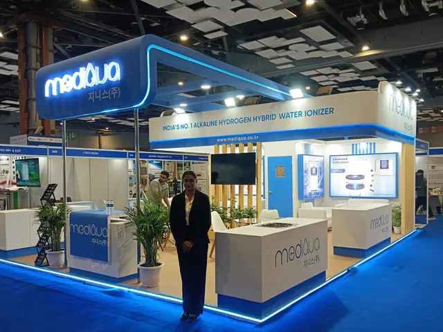 Mediqua water ionizer exhibition booth in New Delhi with curved fascia and blue LED outline