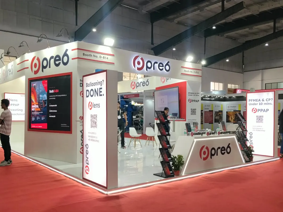 pre6 exhibition booth with backlit lightboxes, video wall and reception counter